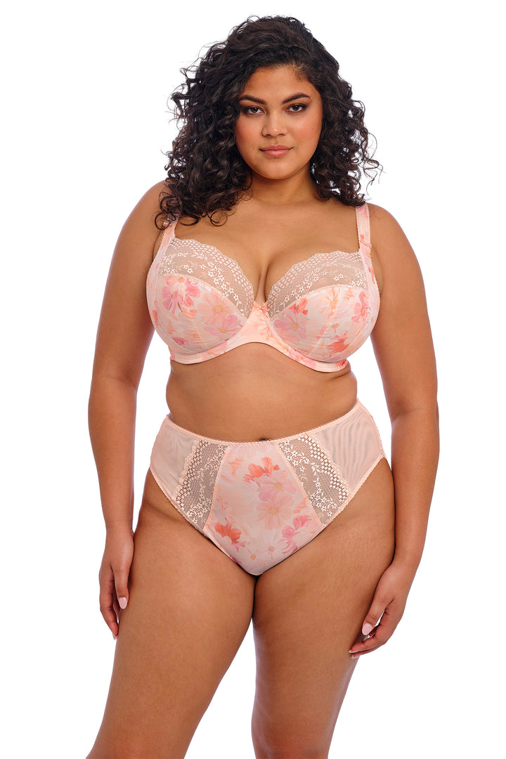 Woman wearing a floral lingerie set on a white background